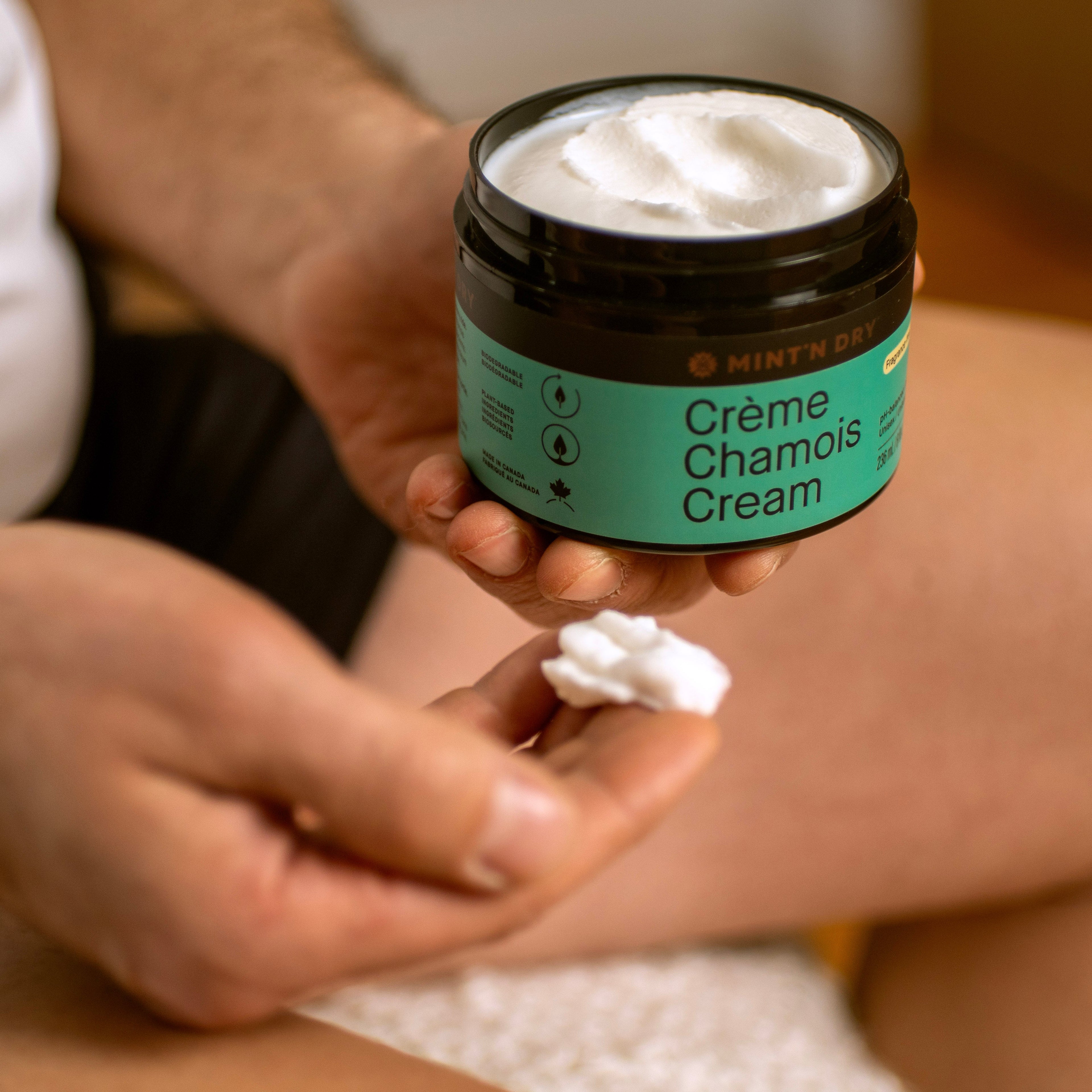 Cyclist applying MINT'N DRY Chamois Cream before a long ride to prevent chafing and saddle discomfort