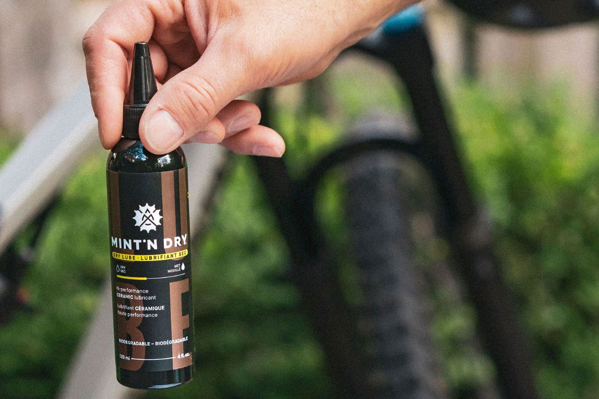 Applying MINT'N DRY Ceramic Dry Lube directly onto a bike chain